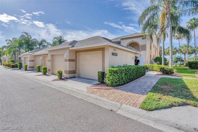 10225 Bismark Palm Way Unit 1626, Fort Myers, FL 33966 - view of front facade with stucco siding, a garage, and concrete driveway