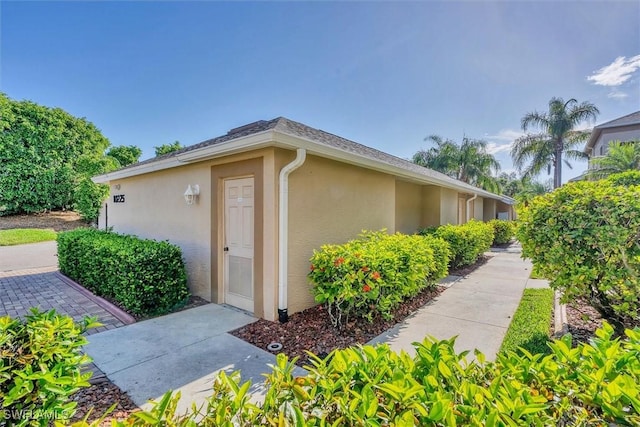 10225 Bismark Palm Way Unit 1626, Fort Myers, FL 33966 - view of side of home featuring stucco siding