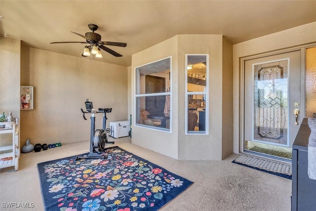 10225 Bismark Palm Way Unit 1626, Fort Myers, FL 33966 - view of exterior entry with a ceiling fan and stucco siding