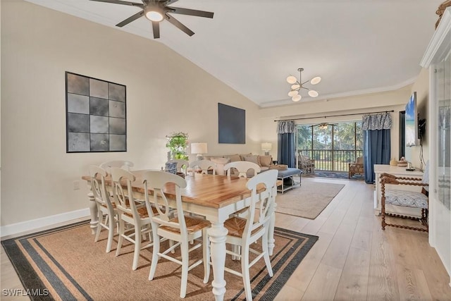10225 Bismark Palm Way Unit 1626, Fort Myers, FL 33966 - dining room featuring vaulted ceiling, a ceiling fan, light wood finished floors, a chandelier, and crown molding
