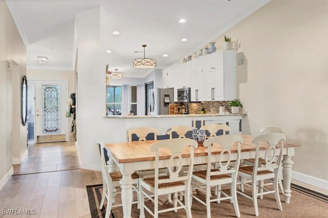 10225 Bismark Palm Way Unit 1626, Fort Myers, FL 33966 - dining space with ornamental molding, baseboards, recessed lighting, and wood finished floors