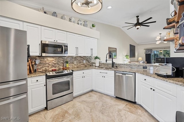 10225 Bismark Palm Way Unit 1626, Fort Myers, FL 33966 - kitchen with appliances with stainless steel finishes, backsplash, crown molding, a ceiling fan, and vaulted ceiling