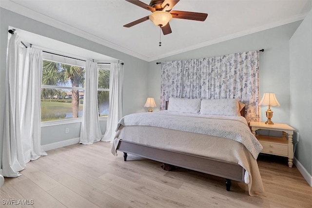 10225 Bismark Palm Way Unit 1626, Fort Myers, FL 33966 - bedroom featuring ornamental molding, vaulted ceiling, wood finished floors, and a ceiling fan