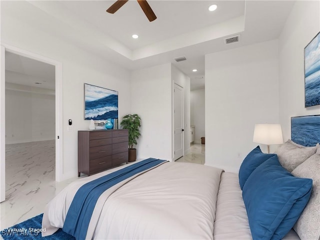 203 E 10th St, Lehigh Acres, FL 33972 - bedroom featuring marble look tiles, recessed lighting, a tray ceiling, and a ceiling fan