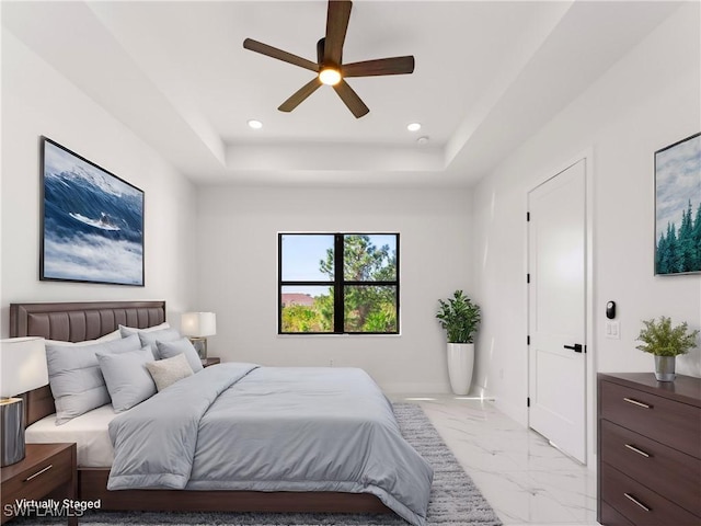 203 E 10th St, Lehigh Acres, FL 33972 - bedroom featuring light marble finish flooring, a tray ceiling, recessed lighting, and a ceiling fan
