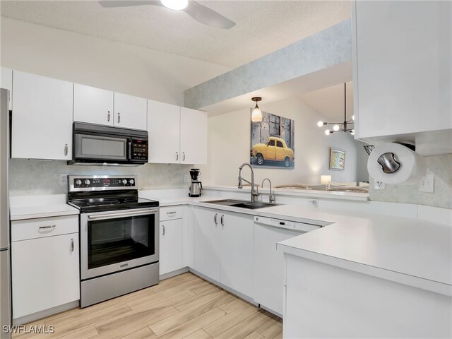 935 New Waterford Dr Unit F204, Naples, FL 34104 - kitchen featuring a sink, black microwave, light countertops, white dishwasher, and electric stove