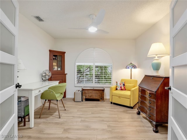 935 New Waterford Dr Unit F204, Naples, FL 34104 - office space featuring ceiling fan, light wood-style flooring, a textured ceiling, and visible vents
