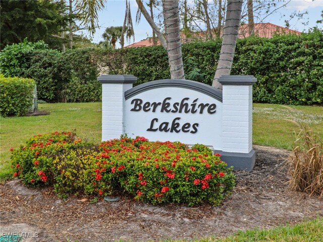 935 New Waterford Dr Unit F204, Naples, FL 34104 - community / neighborhood sign featuring a lawn
