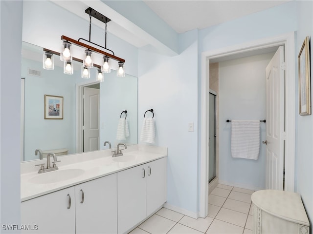 935 New Waterford Dr Unit F204, Naples, FL 34104 - full bath with visible vents, tile patterned flooring, a shower stall, and a sink