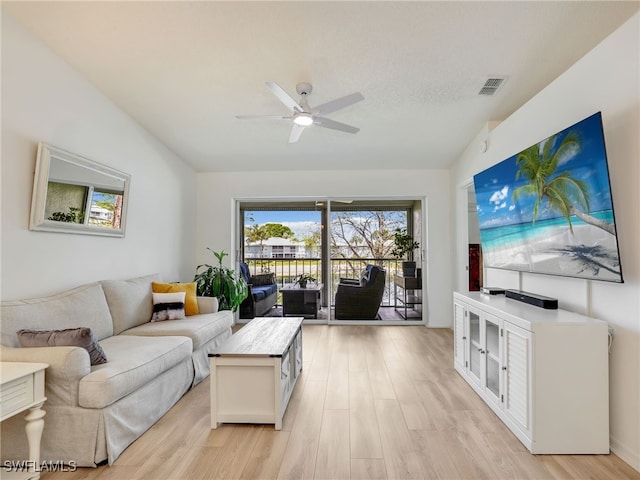 935 New Waterford Dr Unit F204, Naples, FL 34104 - living room with a ceiling fan, light wood-style flooring, visible vents, and vaulted ceiling
