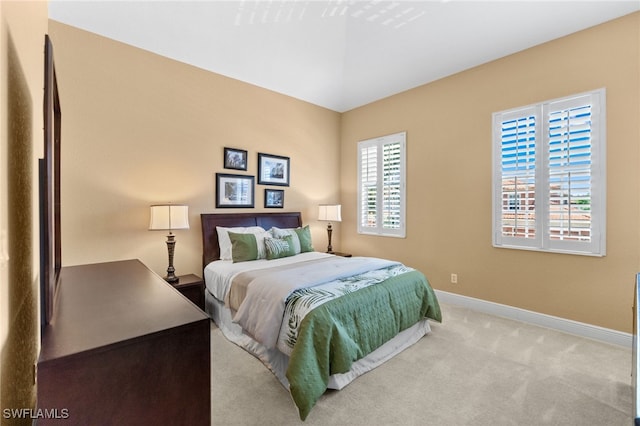 bedroom with carpet and baseboards
