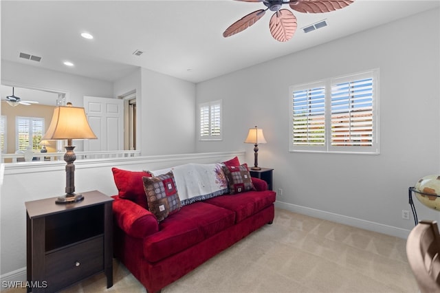 carpeted living area with ceiling fan, baseboards, visible vents, and recessed lighting