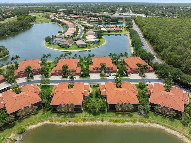 birds eye view of property featuring a water view and a residential view