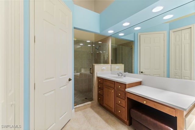 full bath with vanity, tile patterned flooring, a shower stall, and recessed lighting