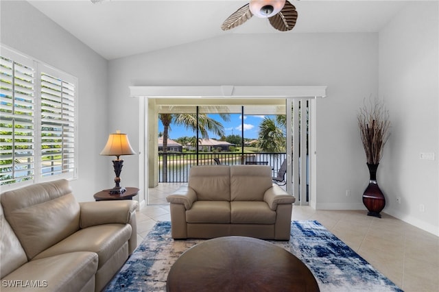 living room featuring ceiling fan, a healthy amount of sunlight, and tile patterned floors