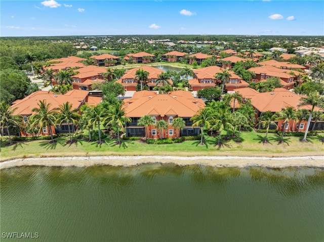 bird's eye view with a water view and a residential view