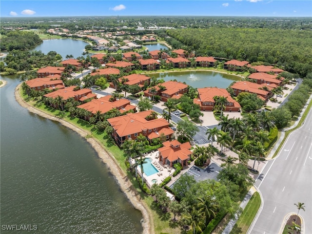 birds eye view of property featuring a water view and a residential view