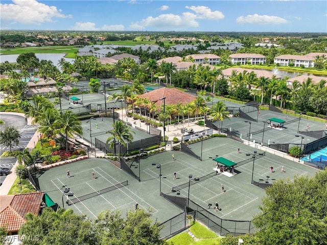 birds eye view of property featuring a water view and a residential view