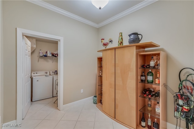 2743 1st St Unit 305, Fort Myers, FL 33916 - hall with light tile patterned floors, baseboards, ornamental molding, and washing machine and clothes dryer