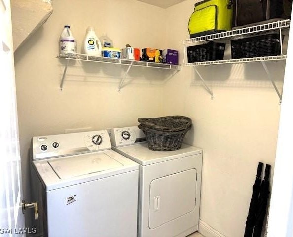 2743 1st St Unit 305, Fort Myers, FL 33916 - washroom featuring laundry area and washer and clothes dryer