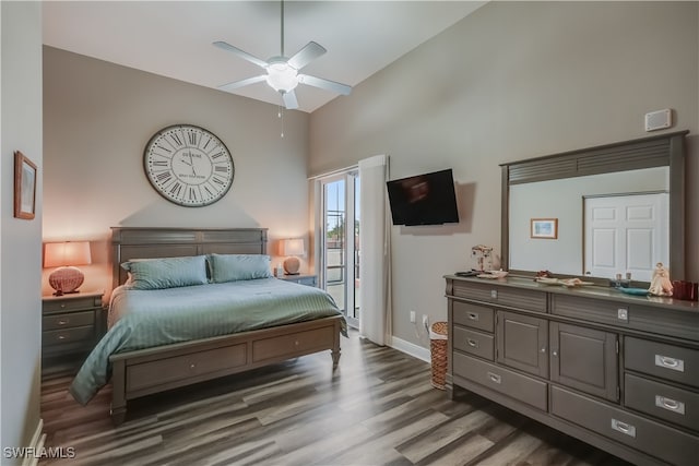 2743 1st St Unit 305, Fort Myers, FL 33916 - bedroom with baseboards, ceiling fan, wood finished floors, and high vaulted ceiling
