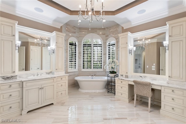bathroom featuring an inviting chandelier, ornamental molding, marble finish floor, and a freestanding bath