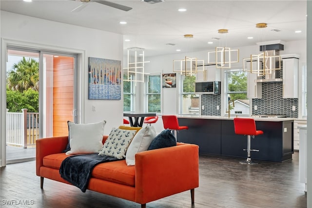 8605 Inwood Dr, Hudson, FL 34667 - living room with wood finished floors, recessed lighting, and a ceiling fan