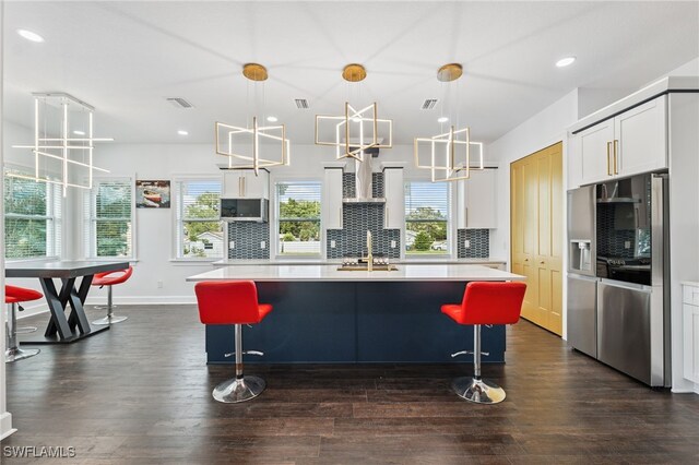 8605 Inwood Dr, Hudson, FL 34667 - kitchen featuring stainless steel appliances, light countertops, dark wood finished floors, tasteful backsplash, and recessed lighting