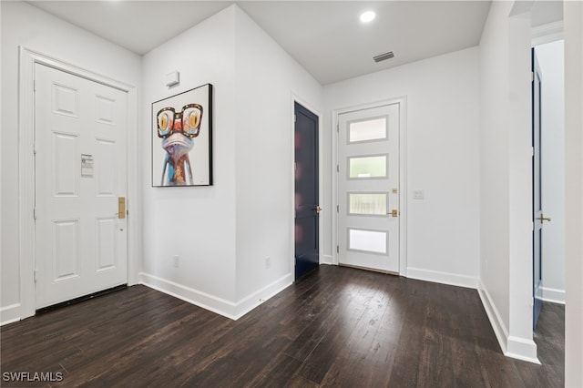 8605 Inwood Dr, Hudson, FL 34667 - entryway featuring dark wood-style floors and baseboards