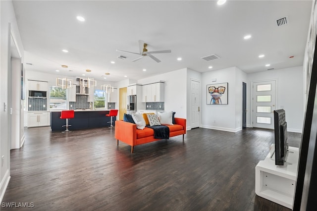 8605 Inwood Dr, Hudson, FL 34667 - living room featuring a ceiling fan, dark wood-style flooring, and recessed lighting