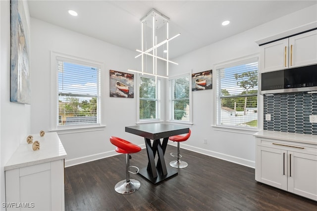 8605 Inwood Dr, Hudson, FL 34667 - dining area featuring dark wood finished floors and recessed lighting