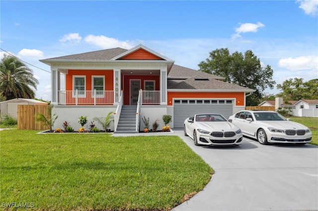 8605 Inwood Dr, Hudson, FL 34667 - view of front of home with concrete driveway, a garage, stairway, and a front yard