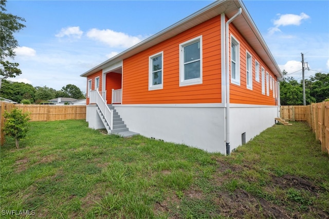 8605 Inwood Dr, Hudson, FL 34667 - view of property exterior with a fenced backyard and stairway