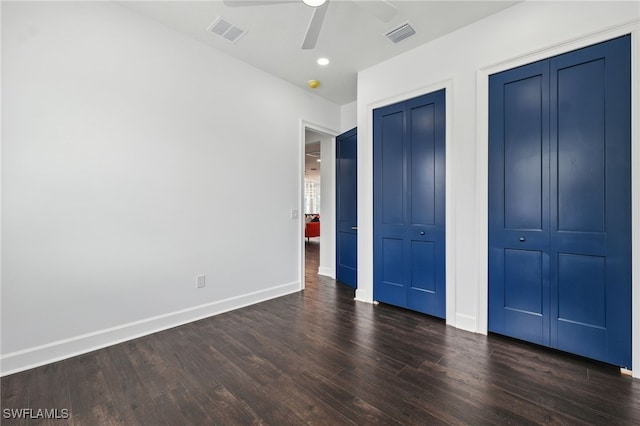 8605 Inwood Dr, Hudson, FL 34667 - unfurnished bedroom with dark wood-style flooring, a ceiling fan, two closets, and recessed lighting