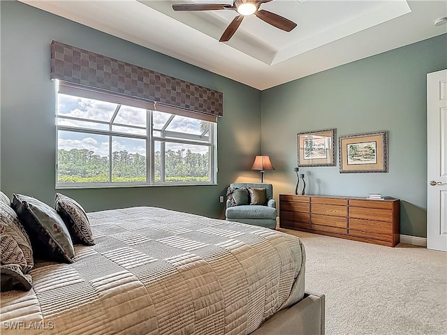 10843 Valentina Ct, Fort Myers, FL 33913 - carpeted bedroom featuring a tray ceiling and a ceiling fan