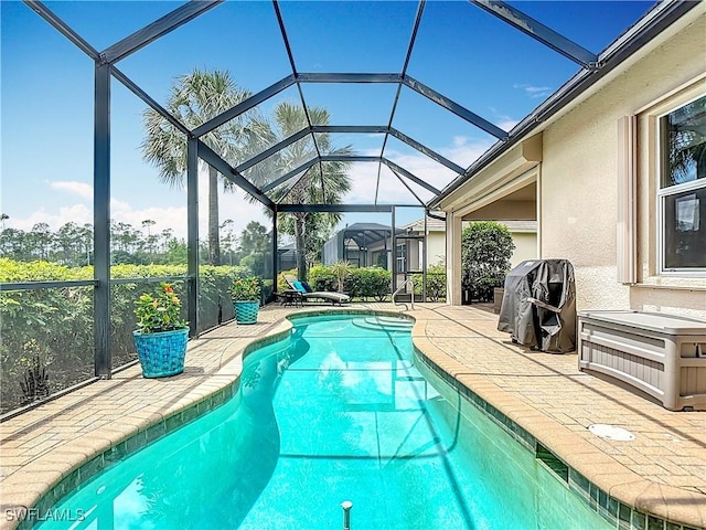 10843 Valentina Ct, Fort Myers, FL 33913 - outdoor pool featuring a patio area and glass enclosure