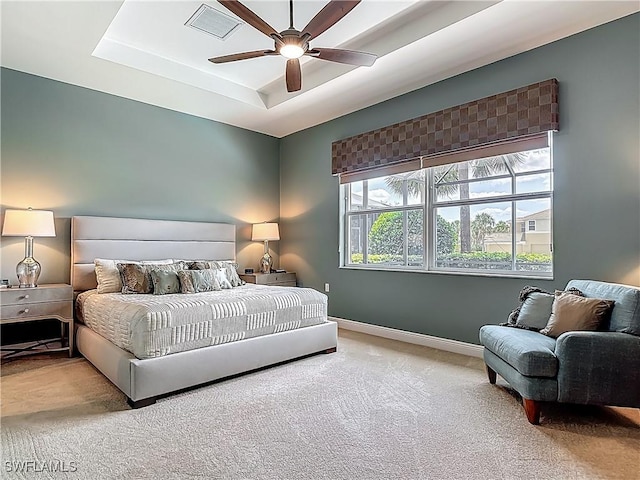 10843 Valentina Ct, Fort Myers, FL 33913 - carpeted bedroom with baseboards, a tray ceiling, and a ceiling fan