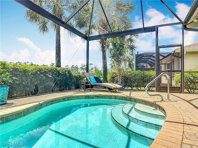10843 Valentina Ct, Fort Myers, FL 33913 - outdoor pool with glass enclosure and a patio
