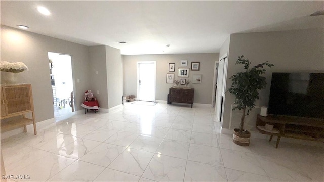 1005 E Penn Rd, Lehigh Acres, FL 33936 - living room featuring baseboards, recessed lighting, and marble finish floor