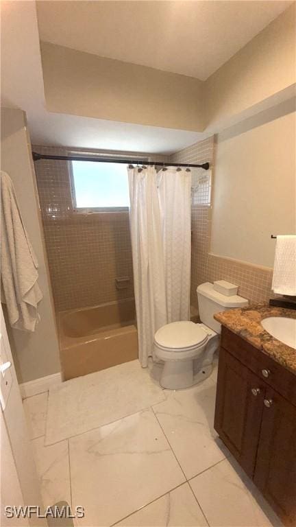 1005 E Penn Rd, Lehigh Acres, FL 33936 - bathroom featuring vanity, shower / bath combo, toilet, and tile walls