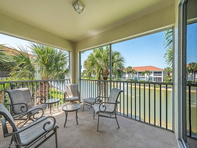 sunroom with a water view