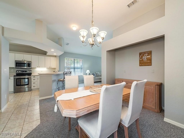 dining space featuring a chandelier, baseboards, and light colored carpet