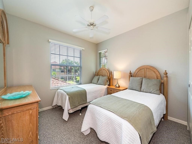 bedroom with carpet flooring, baseboards, and ceiling fan