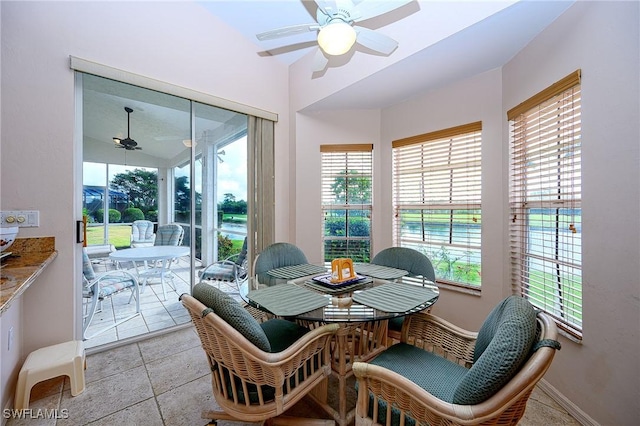 sunroom featuring plenty of natural light and baseboards