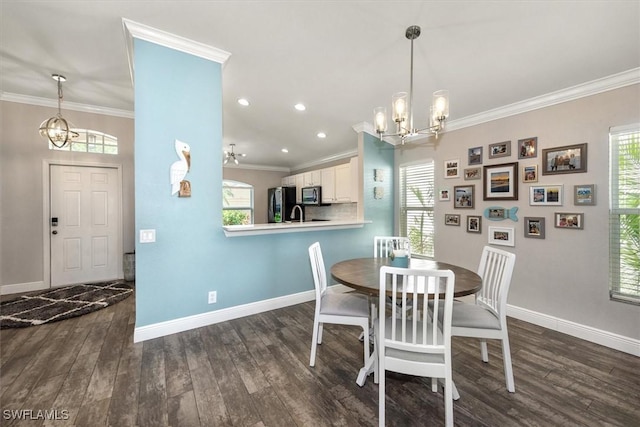 dining space with baseboards, plenty of natural light, dark wood-style flooring, and a notable chandelier