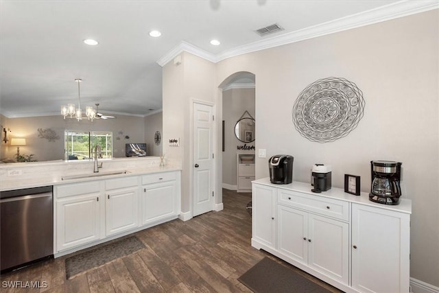 kitchen with visible vents, crown molding, dark wood finished floors, dishwasher, and a sink