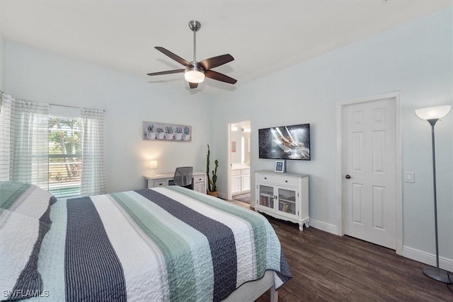 bedroom with a ceiling fan, baseboards, dark wood finished floors, and ensuite bath