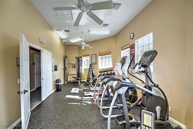 workout area featuring ceiling fan, visible vents, and baseboards