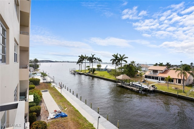 1766 Cape Coral Pkwy E Unit 310, Cape Coral, FL 33904 - water view featuring a dock and nearby suburban area