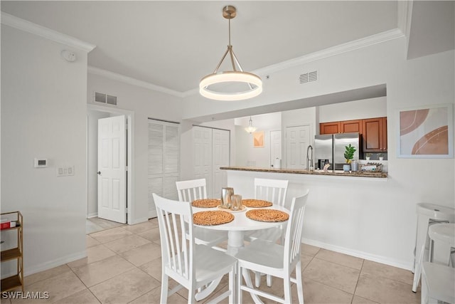 dining space featuring ornamental molding, light tile patterned floors, and visible vents